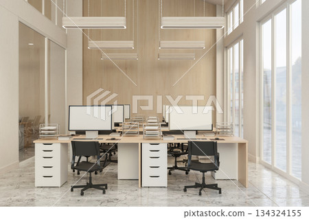 Computer on drawer table and swivel chair on marble floor and wall window in office room at company. 134324155