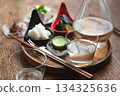 A set of chilled unpasteurized sake and Japanese-style snacks such as pickles and chilled tofu A set of chilled unpasteurized sake and Japanese-style snacks such as pickles and chilled tofu 134325636