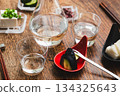 A cold sake set with unpasteurized sake, pickles, and chilled tofu A cold sake set with unpasteurized sake, pickles, and chilled tofu 134325643