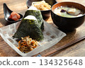 A simple Japanese breakfast of rice balls, miso soup, and side dishes A simple Japanese breakfast of rice balls, miso soup, and side dishes 134325648