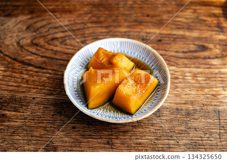 A classic side dish, sweet simmered pumpkin, served on a small plate 134325650