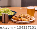 Fried skewers and beer at home 134327101