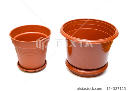 two brown plastic flower pots of different sizes on a white background 134327113
