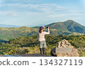 Back view of climbing woman 134327119