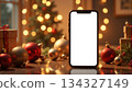 christmas smartphone mockup with festive decorations and blank screen. 134327149