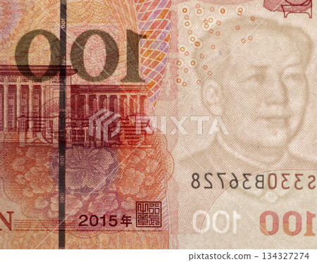 100 yuan in a bright light from behind, a close-up of Chinese money with watermarks and obverse and reverse simultaneously in a bright light from behind 134327274