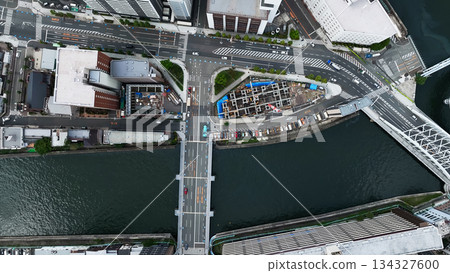 Aerial view of modern city and roads taken by drone Aerial view of modern city and roads taken by drone 134327600