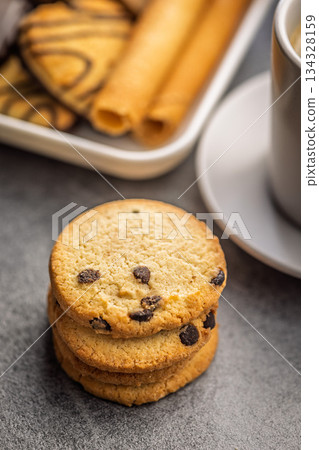 Sweet chocolate cookies on kitchen table. Sweet chocolate cookies on kitchen table. 134328159