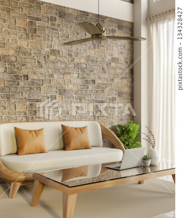 Laptop on glass top wooden table aside sofa and brick wall with ceiling fan in living room or lounge Laptop on glass top wooden table aside sofa and brick wall with ceiling fan in living room or lounge 134328427