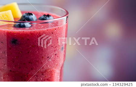 Berry Smoothie with Blueberries and Pineapple in Glass 134329425