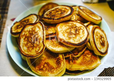 Fluffy Pancakes Oladyi on a Plate Fluffy Pancakes Oladyi on a Plate 134329905