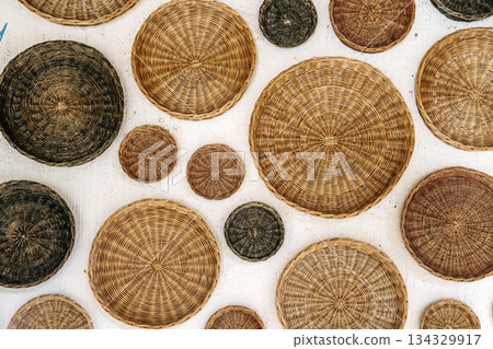 Woven Rattan Baskets Wall Decor Background Woven Rattan Baskets Wall Decor Background 134329917