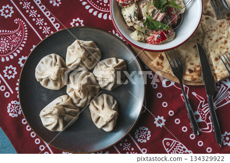 Traditional Georgian Khinkali Dumplings on a Plate Traditional Georgian Khinkali Dumplings on a Plate 134329922