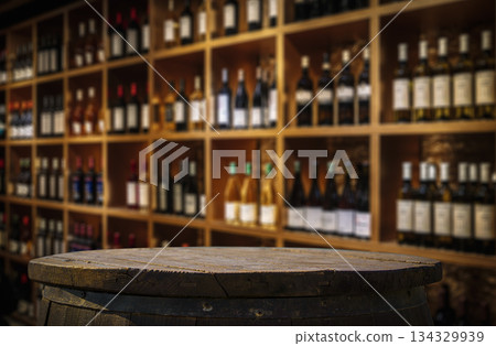 Dark Wood Table Top with Blurred Wine Bottle Shelves Background 134329939