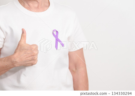 Elderly woman with light Purple Ribbon for All cancer, April Esophageal Cancer, January Thyroid disease, September Hodgkin Lymphoma, Awareness month and February World cancer day concepts 134330294