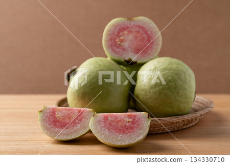 Guava on wooden background, Tropical fruit high vitamin C Guava on wooden background, Tropical fruit high vitamin C 134330710