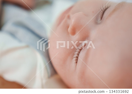 Baby peacefully sleeping on a soft surface Baby peacefully sleeping on a soft surface 134331692