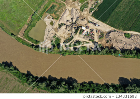 Aerial view of river sand and gravel exploitation, pit, quarry, ballast Aerial view of river sand and gravel exploitation, pit, quarry, ballast 134331698