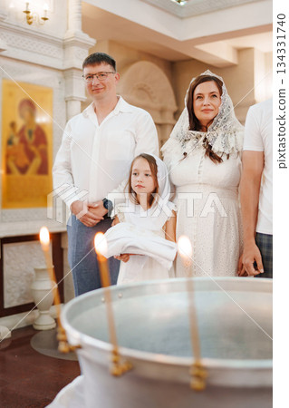 Family celebrates special event at a church in summer Family celebrates special event at a church in summer 134331740