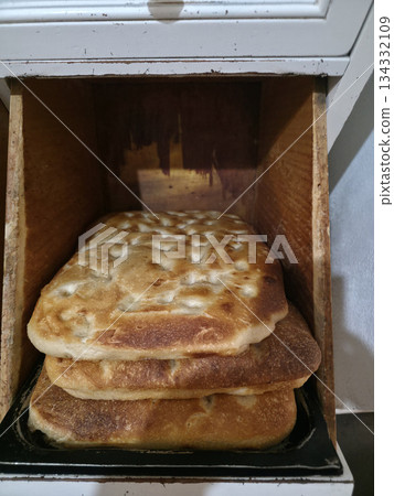 Handmade liguria focaccia in a bakery Handmade liguria focaccia in a bakery 134332109