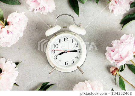 Concept of Time with Flowers and Vintage Alarm Clock Concept of Time with Flowers and Vintage Alarm Clock 134332408