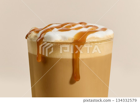 closeup of caramel latte coffee glass closeup of caramel latte coffee glass 134332579
