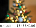 Colorful bokeh from a garland on a Christmas tree 134334106