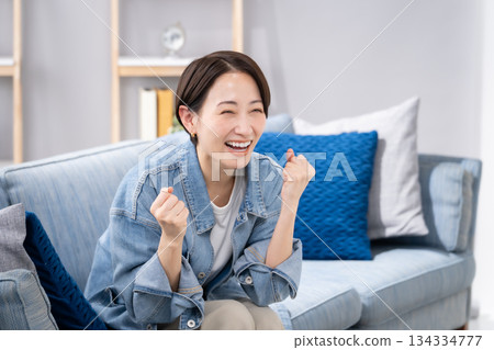 Women cheering watching sports Women cheering watching sports 134334777