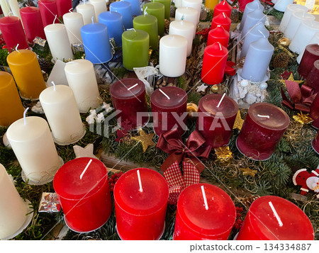 Lots of Christmas candles at the market. Holiday shopping Lots of Christmas candles at the market. Holiday shopping 134334887