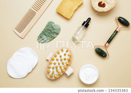 Skincare set with marble roller, gua sha, wooden body brush, facial cream and serum for natural beauty care Skincare set with marble roller, gua sha, wooden body brush, facial cream and serum for natural beauty care 134335363