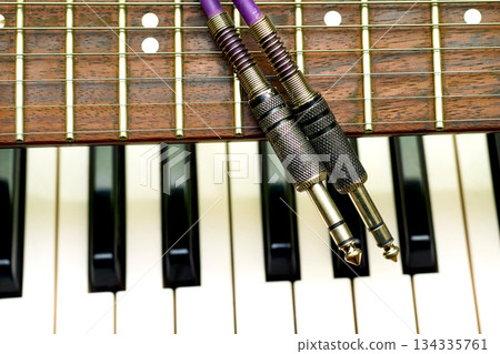Two jacks for connect on guitar neck piano synth keys 134335761
