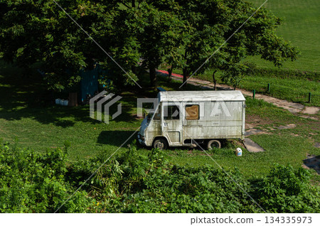 Abandoned car in a vacant lot Abandoned car in a vacant lot 134335973