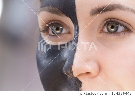 Woman with charcoal facial mask Woman with charcoal facial mask 134336442