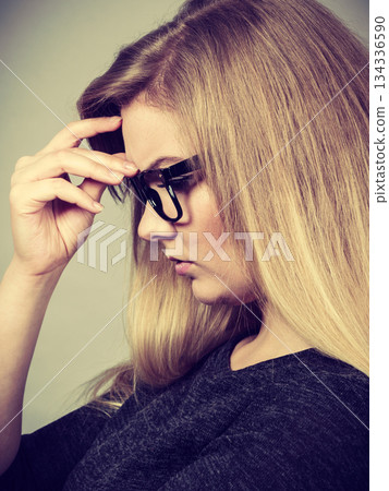 Closeup of woman thinking face expression 134336590