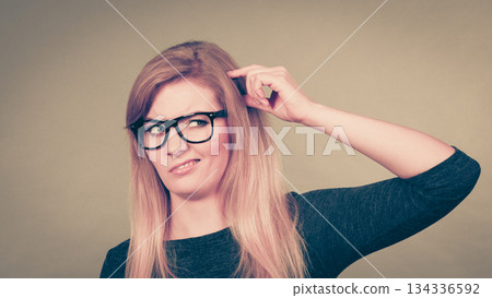 Closeup of woman thinking face expression 134336592