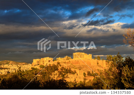 View of the Acropolis Hill, crowned with Parthenon during evening golden hour from the Philopappos Hill in Athens, Greece 134337580