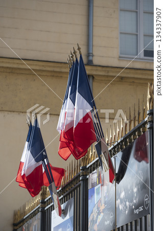 French flags waving proudly at the Prefecture in France under a bright sky French flags waving proudly at the Prefecture in France under a bright sky 134337907