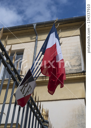 French flags waving proudly at the Prefecture in France under a bright sky French flags waving proudly at the Prefecture in France under a bright sky 134337910