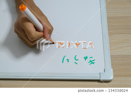 Hand writing on a whiteboard Hand writing on a whiteboard 134338024
