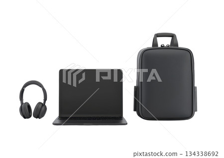 A sleek laptop, stylish backpack, and modern headphones arranged neatly together. 134338692