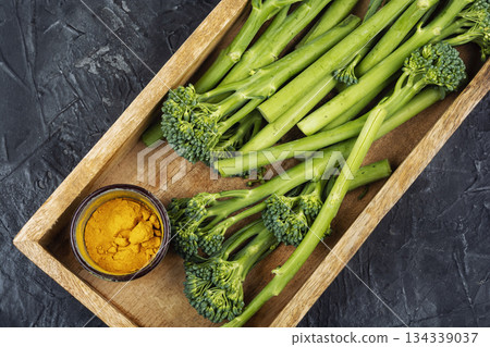 Fresh baby broccoli laid out for healthy cooking 134339037