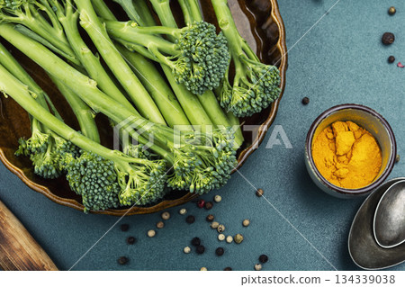 Fresh baby broccoli laid out for healthy cooking Fresh baby broccoli laid out for healthy cooking 134339038