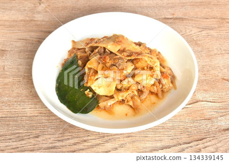 spicy fried slice pickled bamboo shoot with beef meat in curry sauce on plate 134339145