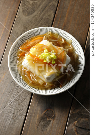 Silken tofu in thick sauce 134340089