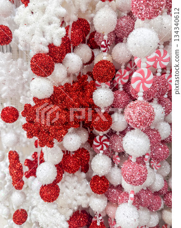 Red and White Candy Style Christmas Garlands and Festive Decorations Close Up Red and White Candy Style Christmas Garlands and Festive Decorations Close Up 134340612