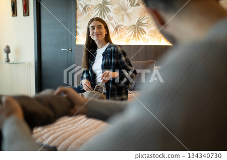 Traveler unpacking a suitcase after arriving to the hotel 134340730