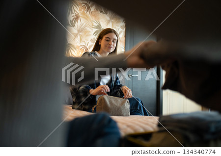 Young couple unpacking after arrival to the hotel for vacation 134340774