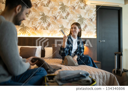 Young couple unpacking after arrival to the hotel for vacation 134340806