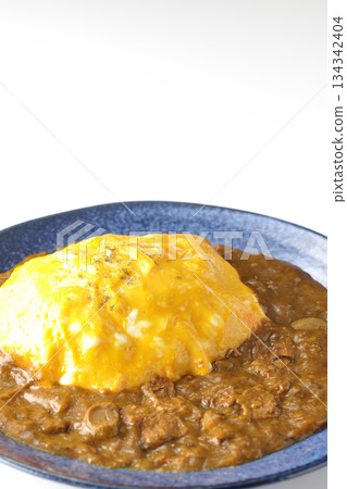 Omelet curry rice photographed on a white background Omelet curry rice photographed on a white background 134342404