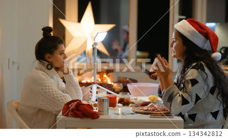 Cozy holiday breakfast with two friends planning campaign 134342812